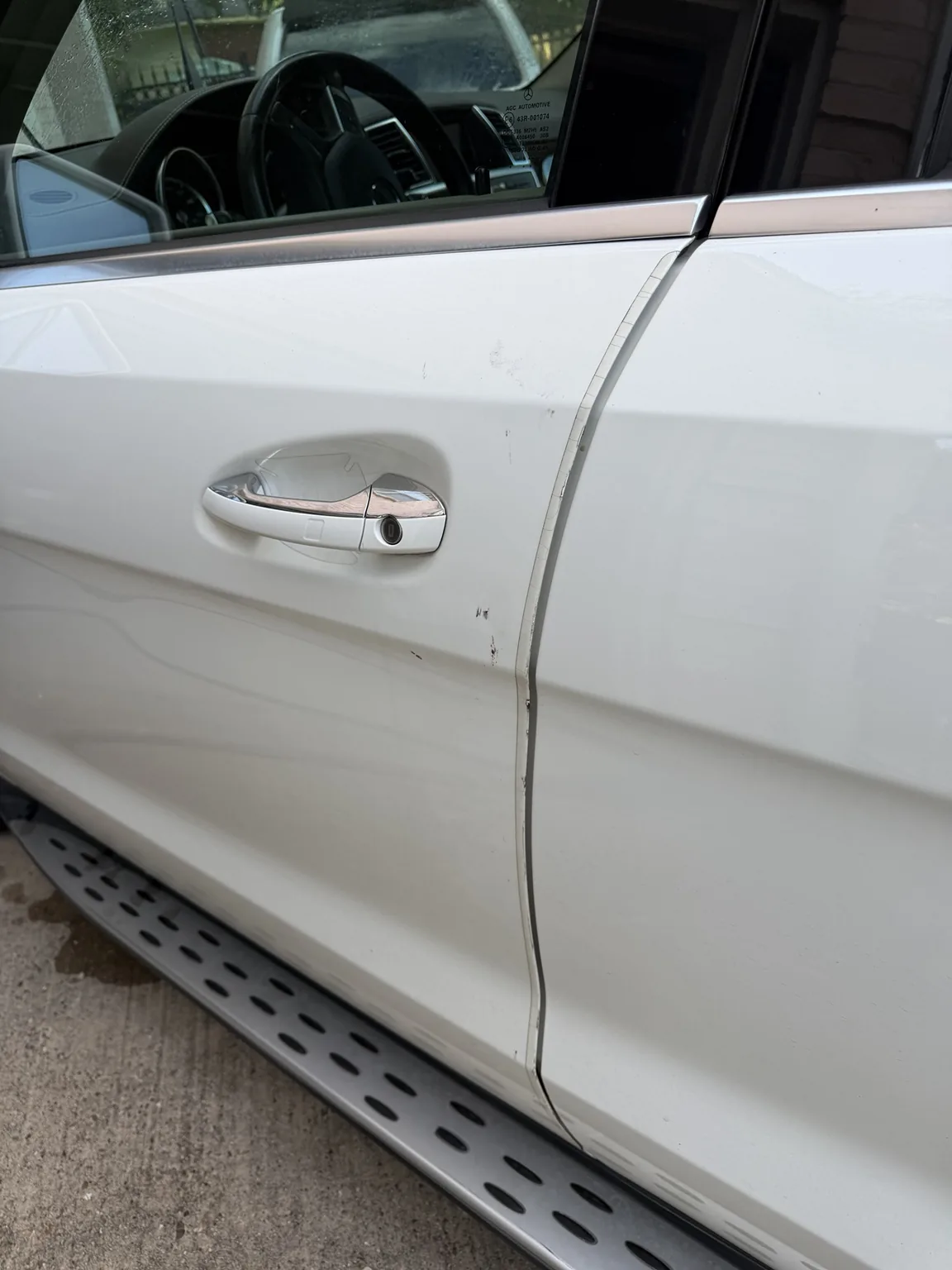 Door scuff before cleanup